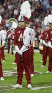 Ms. Kayla Palmer, Woodwind Visual Instructor, performing with the Million Dollar Band at the University of Alabama